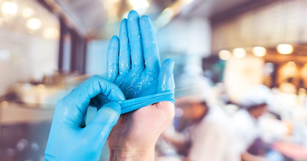 easy on blue nitrile gloves in busy commerical kitchen