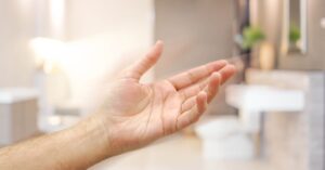 Hand uneffected by Dermatitis in bathroom
