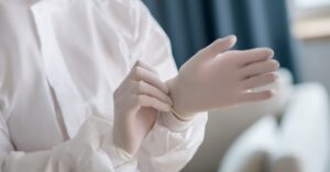Medical worker removing gloves