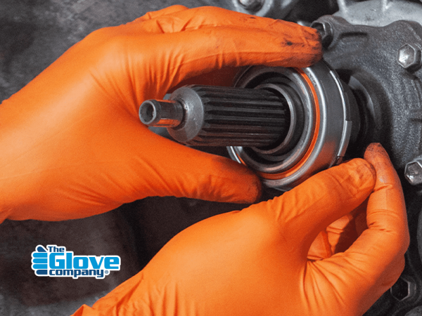 Action_Orange_Rocket_New Hands wearing Orange Rocket gloves fitting a bearing